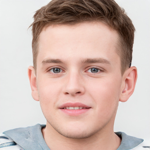 Joyful white child male with short  brown hair and grey eyes