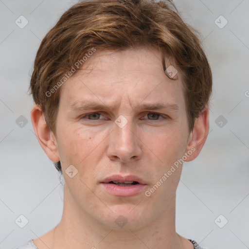 Joyful white adult male with short  brown hair and grey eyes