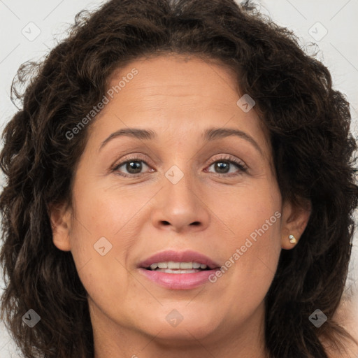 Joyful white adult female with long  brown hair and brown eyes