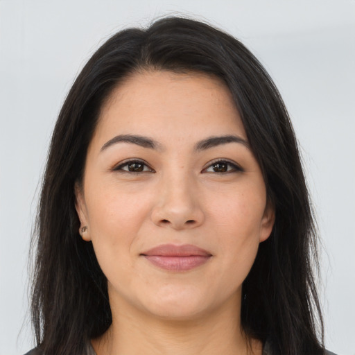 Joyful asian young-adult female with long  brown hair and brown eyes