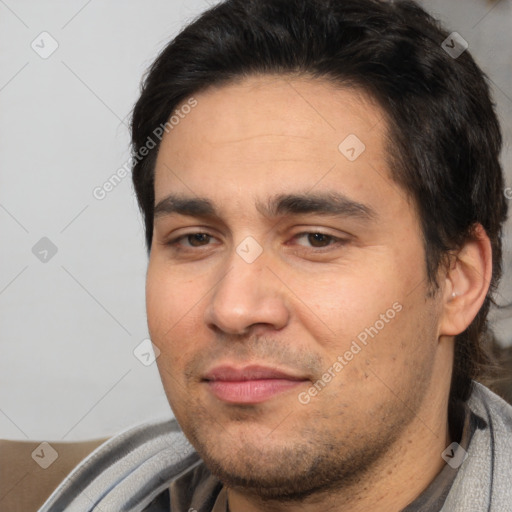 Joyful white young-adult male with short  black hair and brown eyes