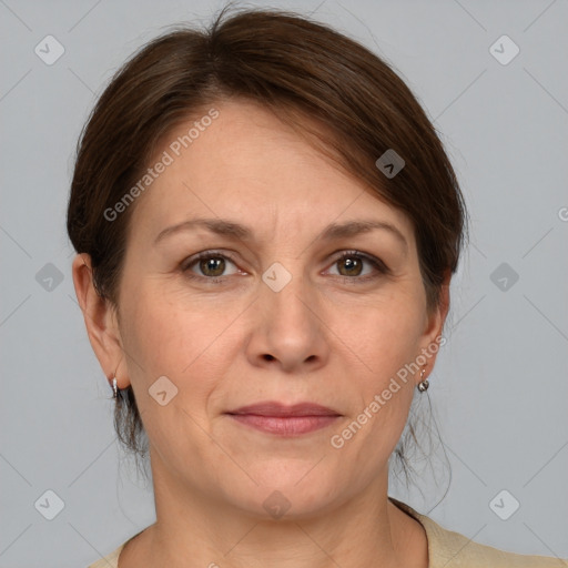 Joyful white adult female with medium  brown hair and grey eyes