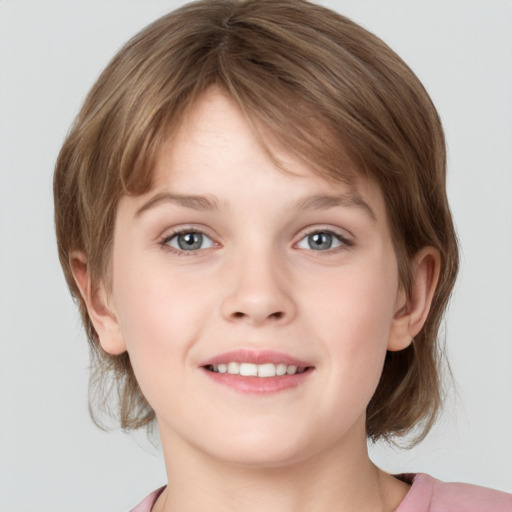 Joyful white child female with medium  brown hair and grey eyes