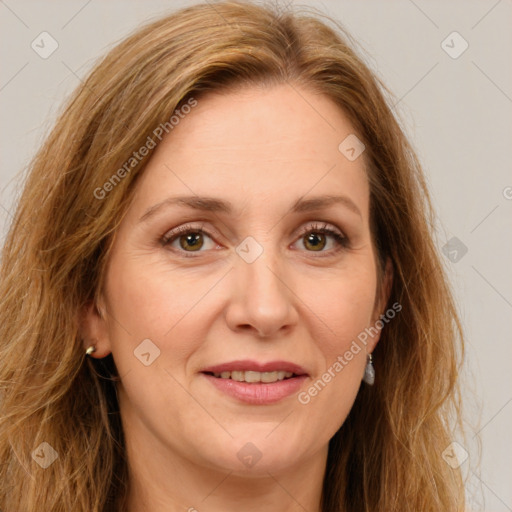 Joyful white adult female with long  brown hair and green eyes