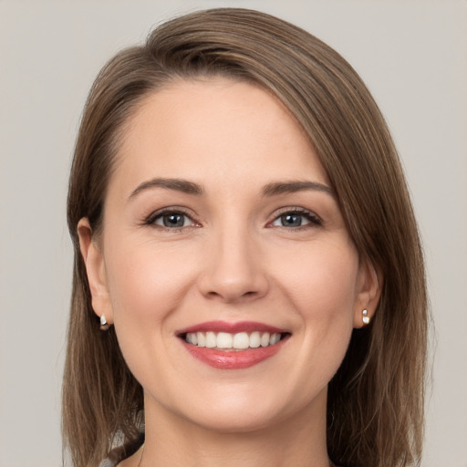 Joyful white young-adult female with medium  brown hair and brown eyes