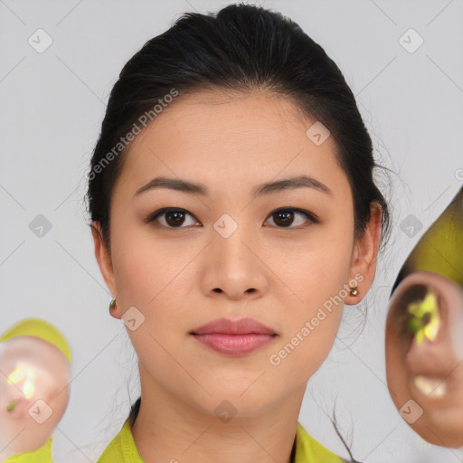 Joyful asian young-adult female with medium  brown hair and brown eyes