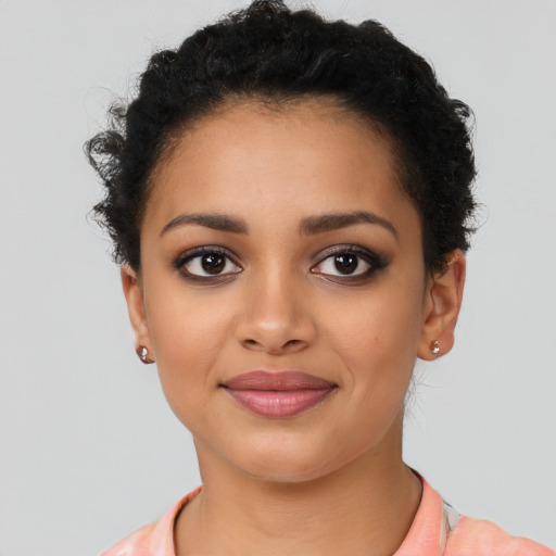Joyful latino young-adult female with short  black hair and brown eyes