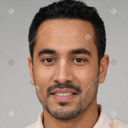 Joyful latino young-adult male with short  black hair and brown eyes