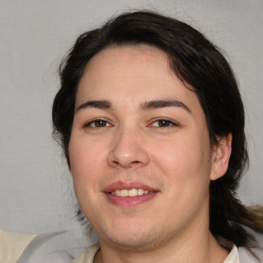 Joyful white adult male with medium  brown hair and brown eyes