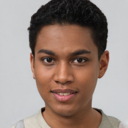 Joyful black young-adult male with short  brown hair and brown eyes