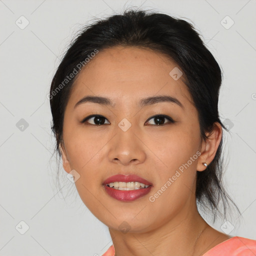 Joyful asian young-adult female with medium  black hair and brown eyes