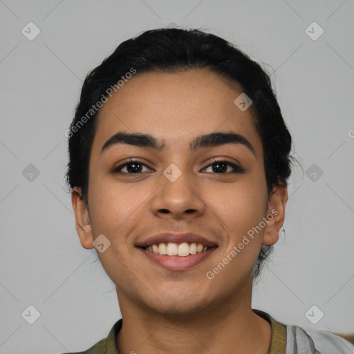 Joyful latino young-adult female with short  black hair and brown eyes