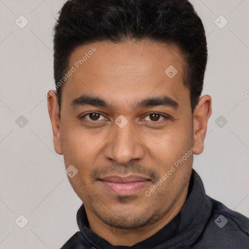 Joyful latino young-adult male with short  black hair and brown eyes