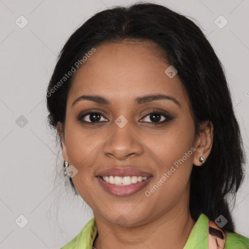 Joyful black young-adult female with medium  brown hair and brown eyes