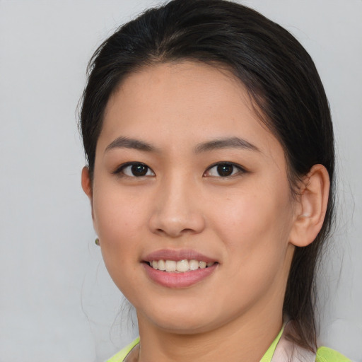 Joyful white young-adult female with medium  brown hair and brown eyes