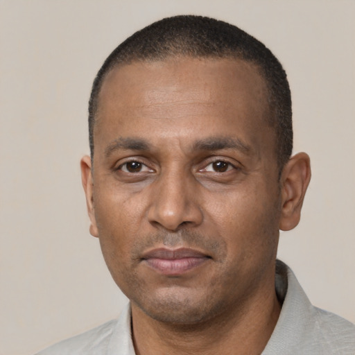 Neutral black adult male with short  black hair and brown eyes