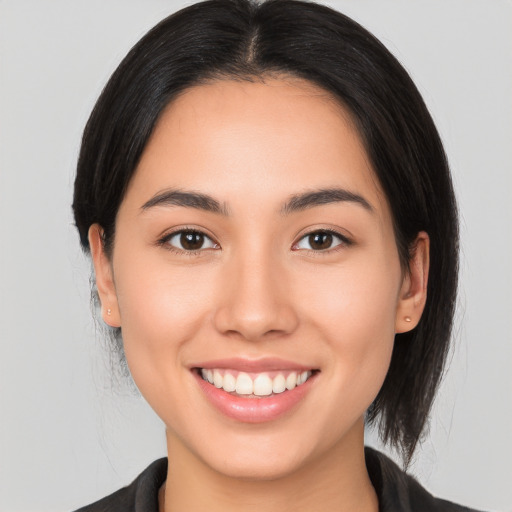 Joyful white young-adult female with medium  brown hair and brown eyes