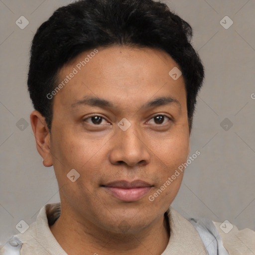 Joyful latino young-adult male with short  brown hair and brown eyes