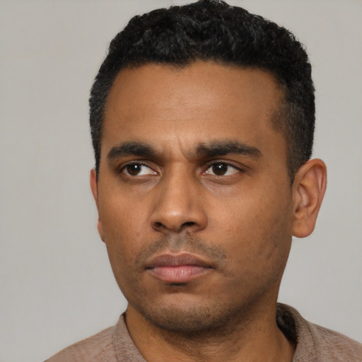 Neutral latino young-adult male with short  black hair and brown eyes