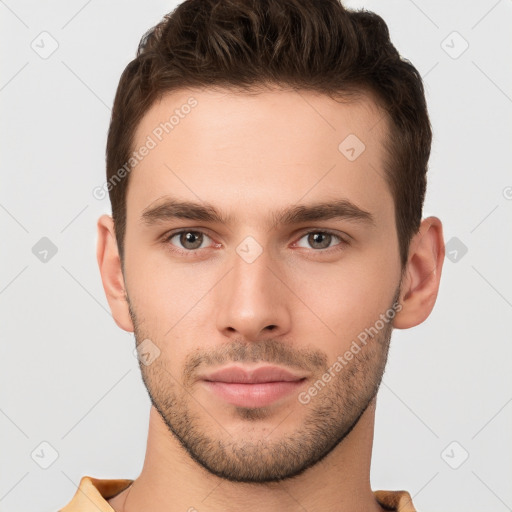 Joyful white young-adult male with short  brown hair and brown eyes