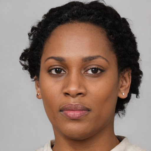 Neutral black young-adult female with short  black hair and brown eyes