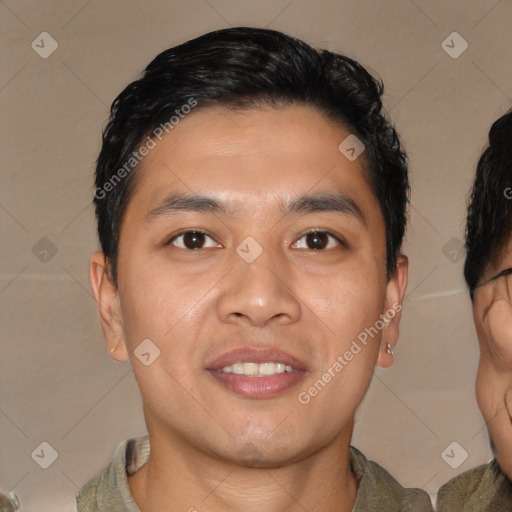 Joyful asian young-adult male with short  black hair and brown eyes