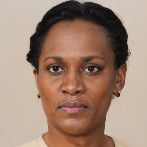 Neutral black adult female with short  black hair and brown eyes