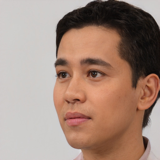 Neutral white young-adult male with short  black hair and brown eyes