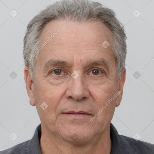 Neutral white middle-aged male with short  gray hair and brown eyes