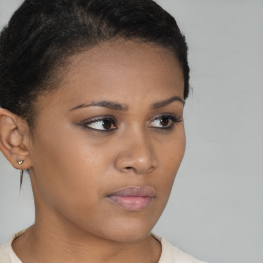 Neutral black young-adult female with short  brown hair and brown eyes