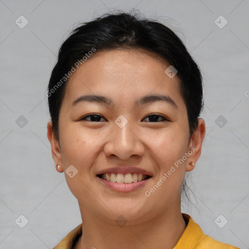 Joyful asian young-adult female with short  brown hair and brown eyes