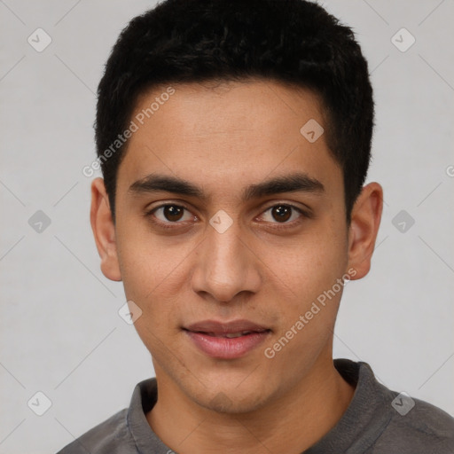 Joyful latino young-adult male with short  brown hair and brown eyes