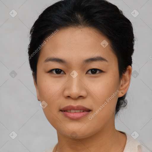 Joyful asian young-adult female with short  brown hair and brown eyes