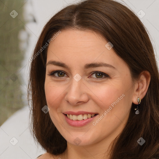 Joyful white young-adult female with long  brown hair and brown eyes