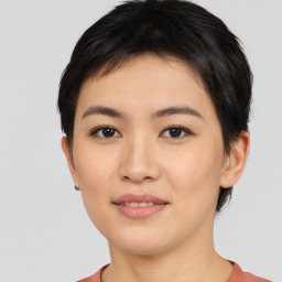 Joyful asian young-adult female with short  black hair and brown eyes