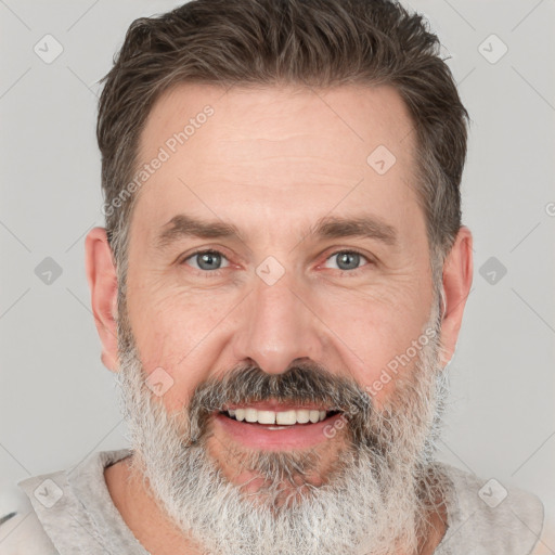 Joyful white adult male with short  brown hair and grey eyes