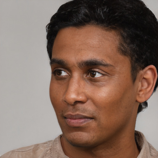 Neutral black young-adult male with short  black hair and brown eyes