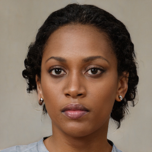 Neutral black young-adult female with medium  black hair and brown eyes