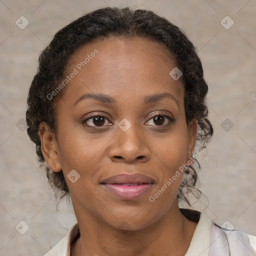 Joyful black adult female with short  brown hair and brown eyes