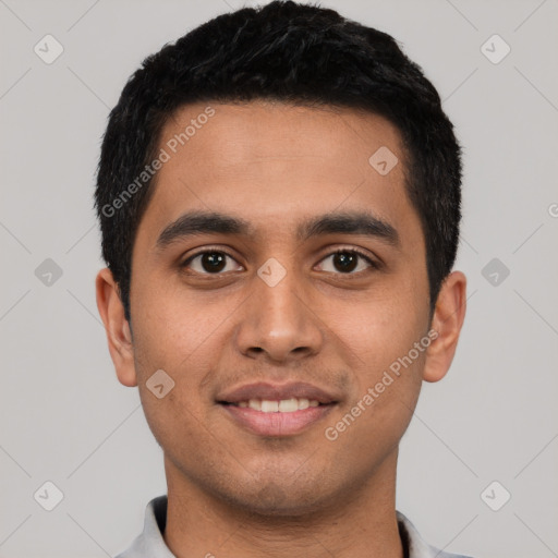 Joyful latino young-adult male with short  black hair and brown eyes