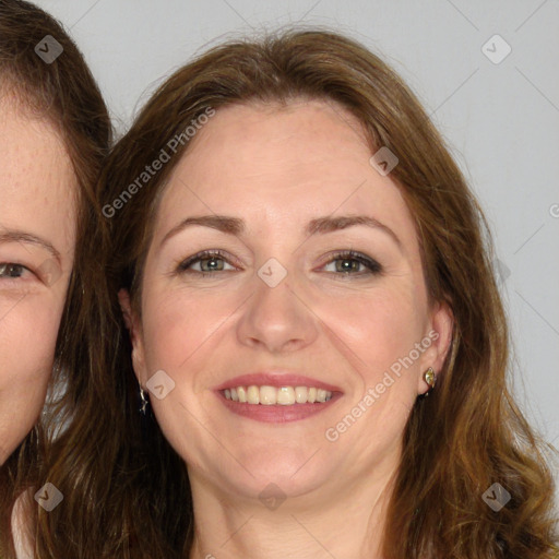 Joyful white adult female with long  brown hair and brown eyes