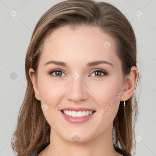 Joyful white young-adult female with long  brown hair and grey eyes