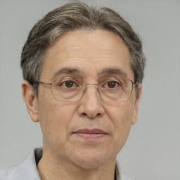 Joyful white middle-aged male with short  brown hair and brown eyes