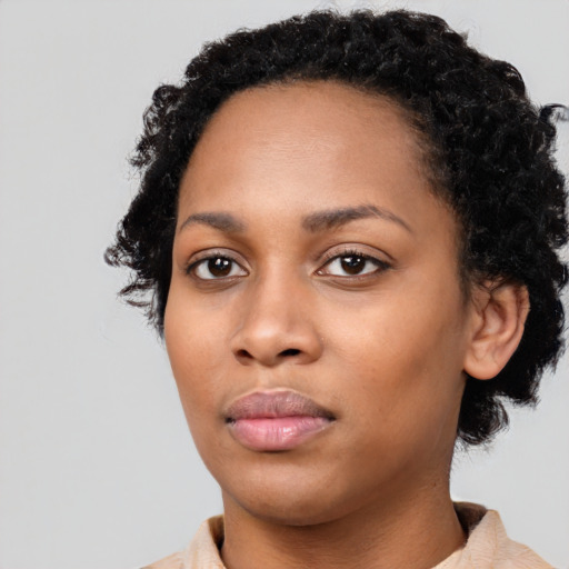Neutral black young-adult female with short  black hair and brown eyes