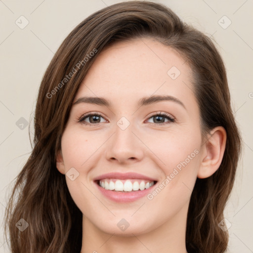 Joyful white young-adult female with long  brown hair and green eyes