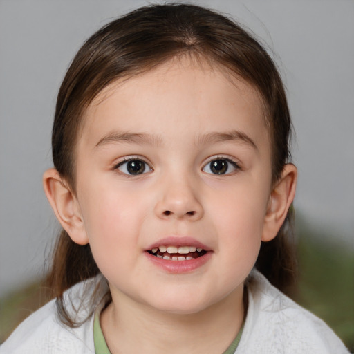 Joyful white child female with medium  brown hair and brown eyes