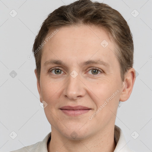 Joyful white adult male with short  brown hair and grey eyes