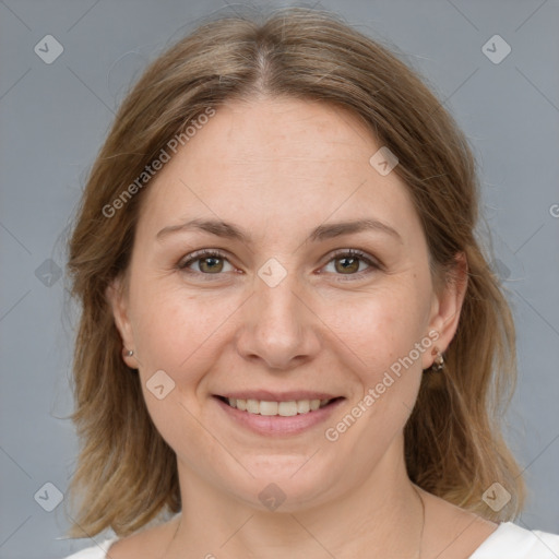 Joyful white adult female with medium  brown hair and grey eyes