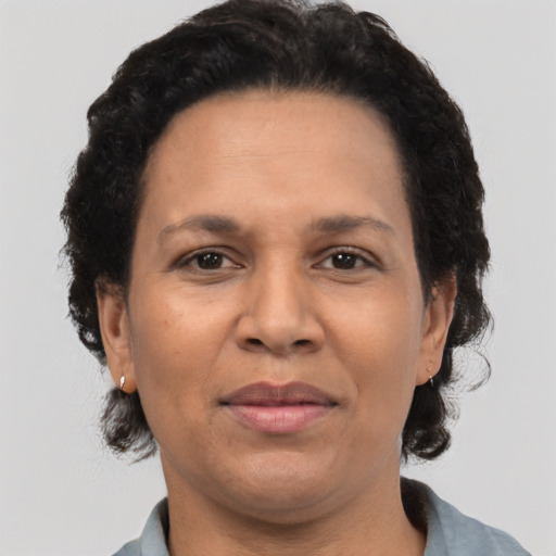 Joyful black adult female with short  brown hair and brown eyes
