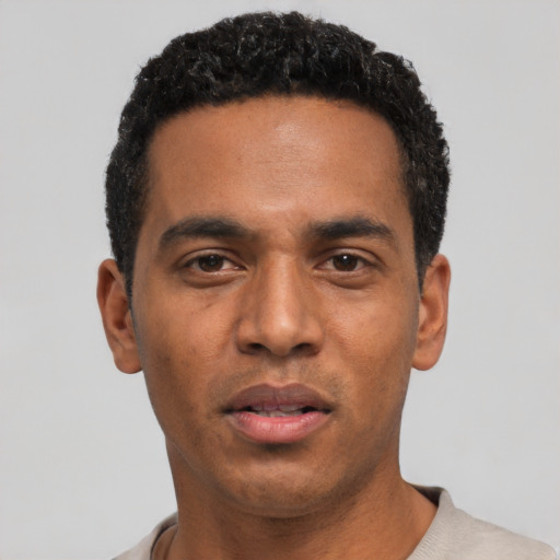 Neutral black young-adult male with short  black hair and brown eyes